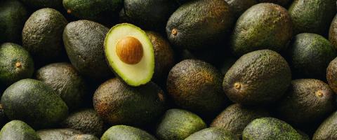 Lots of avocados with halved avocado with seeds in a pile, vegan food- Stock Photo or Stock Video of rcfotostock | RC-Photo-Stock