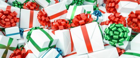 Lots of different gifts with colorful bows for Christmas in one big pile- Stock Photo or Stock Video of rcfotostock | RC-Photo-Stock