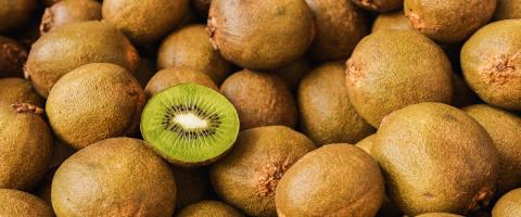 Lots of kiwi fruits with halved kiwi in a pile, vegan food- Stock Photo or Stock Video of rcfotostock | RC Photo Stock