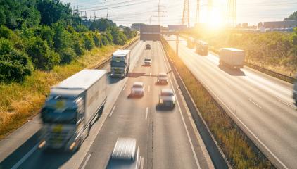 Lots of Trucks and cars on a Highway - transportation concept : Stock Photo or Stock Video Download rcfotostock photos, images and assets rcfotostock | RC Photo Stock.: