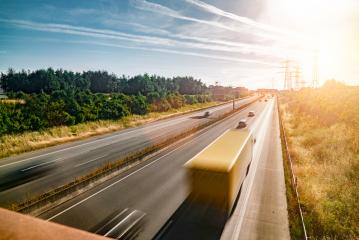 Lots of Trucks and cars on a Highway - transportation concept- Stock Photo or Stock Video of rcfotostock | RC Photo Stock