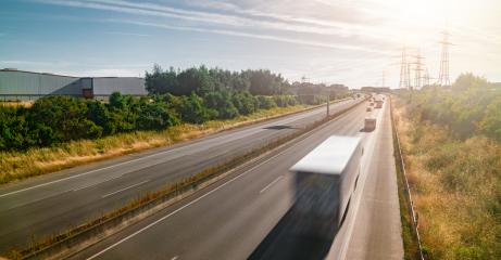 Lots of Trucks and cars on a Highway - transportation concept- Stock Photo or Stock Video of rcfotostock | RC Photo Stock