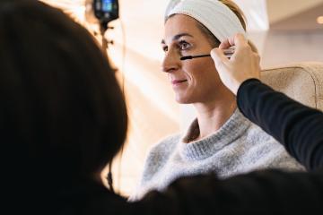 make up assistant applying make up to eyelashes of a model for a photoshoot on location. : Stock Photo or Stock Video Download rcfotostock photos, images and assets rcfotostock | RC Photo Stock.: