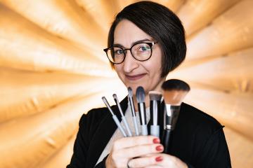 Makeup artist holding a set of makeup brushes at a photostudio- Stock Photo or Stock Video of rcfotostock | RC Photo Stock