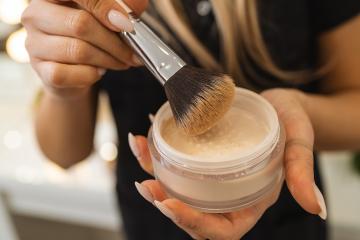 Makeup artist holding powder can with brush for powdering a cust : Stock Photo or Stock Video Download rcfotostock photos, images and assets rcfotostock | RC Photo Stock.: