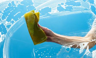 man cleaning a window with yellow cloth- Stock Photo or Stock Video of rcfotostock | RC Photo Stock