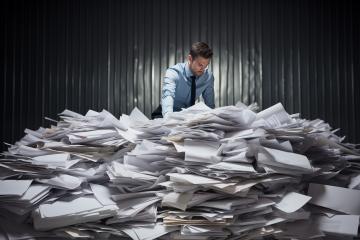 Man overwhelmed by a mountain of paperwork
 : Stock Photo or Stock Video Download rcfotostock photos, images and assets rcfotostock | RC Photo Stock.: