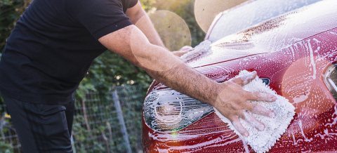 Man worker washing a red car with sponge on a car wash.- Stock Photo or Stock Video of rcfotostock | RC-Photo-Stock