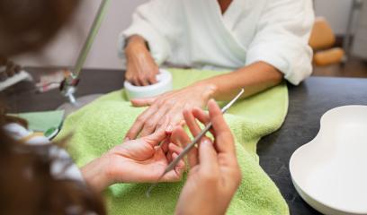 Manicurist working on a client's nails with a file at a spa salon- Stock Photo or Stock Video of rcfotostock | RC Photo Stock