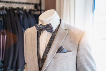 Mannequin dressed in a light gray suit with a plaid bow tie and matching pocket square : Stock Photo or Stock Video Download rcfotostock photos, images and assets rcfotostock | RC Photo Stock.: