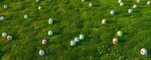 Many colorful easter eggs hunt on a green meadow panorama header- Stock Photo or Stock Video of rcfotostock | RC Photo Stock