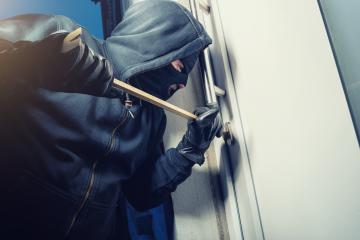 masked burglar opens a door with a crowbar- Stock Photo or Stock Video of rcfotostock | RC-Photo-Stock
