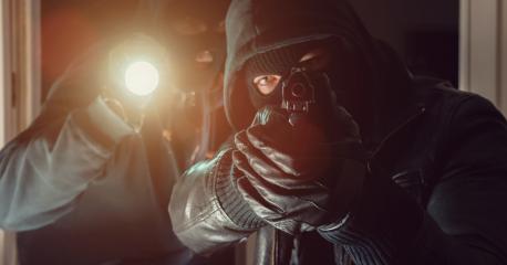masked Burglar with gun and flashlight breaking into a house - Stock Photo or Stock Video of rcfotostock | RC-Photo-Stock