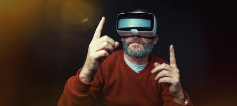 Mature business man wearing virtual reality googles / VR Glasses to work with in modern office- Stock Photo or Stock Video of rcfotostock | RC Photo Stock