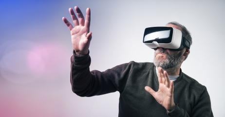 Mature business man wearing virtual reality googles / VR Glasses to work with in modern office- Stock Photo or Stock Video of rcfotostock | RC Photo Stock
