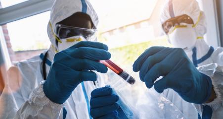 Medical professionals blood sample for Covid-19 test goes to the laboratory by employees in protective clothing- Stock Photo or Stock Video of rcfotostock | RC Photo Stock