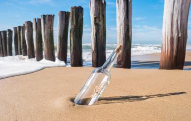 Message in a bottle on beach : Stock Photo or Stock Video Download rcfotostock photos, images and assets rcfotostock | RC-Photo-Stock.: