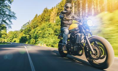 modern scrambler motorbike on the forest road riding. having fun driving the empty road on a motorcycle tour journey. Real dynamic motion blur shot. copyspace for your individual text.- Stock Photo or Stock Video of rcfotostock | RC-Photo-Stock