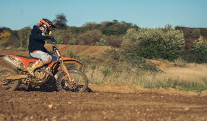 Motocross enduro rider accelerating in dirt track- Stock Photo or Stock Video of rcfotostock | RC Photo Stock