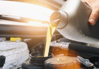 Motor oil pouring to car engine- Stock Photo or Stock Video of rcfotostock | RC-Photo-Stock