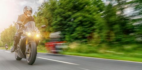 motorbike on the road riding fast. having fun driving the empty road on a motorcycle tour journey. copyspace for your individual text.- Stock Photo or Stock Video of rcfotostock | RC Photo Stock