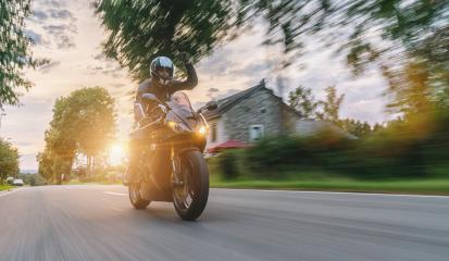 motorbike riding at a country city road. driving on road on a motorcycle tour. copyspace for your individual text.- Stock Photo or Stock Video of rcfotostock | RC-Photo-Stock
