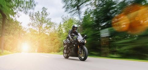 motorbike riding on the forest road. driving on the empty road on a motorcycle trip. copyspace for your individual text.- Stock Photo or Stock Video of rcfotostock | RC Photo Stock