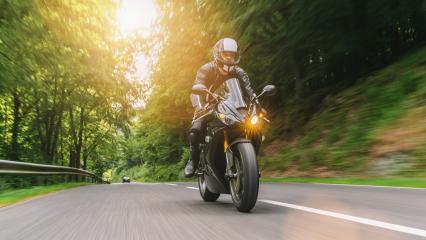 motorbike riding on the forest road. driving on the empty road on a motorcycle tour. copyspace for your individual text.- Stock Photo or Stock Video of rcfotostock | RC Photo Stock