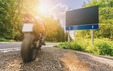 motorbike starts to riding and driving the empty forest road on a motorcycle tour journey. Blank advertising billboard with copyspace for your individual text. - Stock Photo or Stock Video of rcfotostock | RC-Photo-Stock