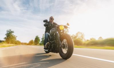 Motorcycle driver riding cruiser on the highway, central Europe.- Stock Photo or Stock Video of rcfotostock | RC-Photo-Stock