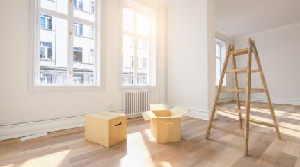 Moving boxes in empty room with ladder as relocation or forwarding agency concept image- Stock Photo or Stock Video of rcfotostock | RC Photo Stock
