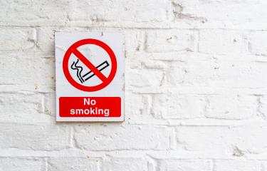 No smoking sign on a white brick wall, copy space for individual text- Stock Photo or Stock Video of rcfotostock | RC-Photo-Stock