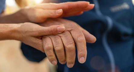 Nurse consoling senior hand of an elderly man in wheelchair, offering comfort and support- Stock Photo or Stock Video of rcfotostock | RC Photo Stock