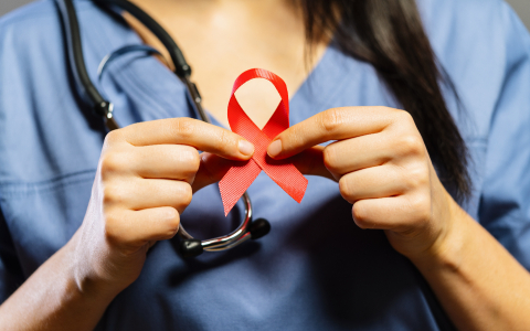 Nurse hold Red ribbon in hands for world aids day  : Stock Photo or Stock Video Download rcfotostock photos, images and assets rcfotostock | RC-Photo-Stock.: