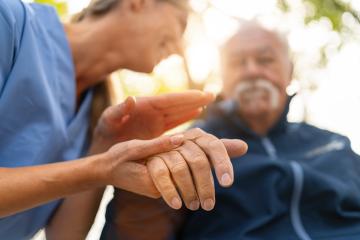 Nurse holding the hand of an elderly man in a wheelchair, both visible in soft focus with a sunlit background, offering comfort and support  : Stock Photo or Stock Video Download rcfotostock photos, images and assets rcfotostock | RC Photo Stock.: