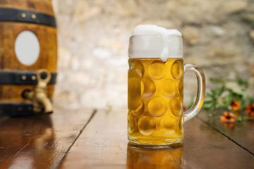 Oktoberfest beer on a wooden table, Munich, Germany - Stock Photo or Stock Video of rcfotostock | RC Photo Stock