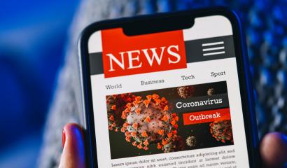Online Corona news on a mobile phone. Close up of woman reading news or articles  about covid-19 in a smartphone screen application. Hand holding smart device. Mockup website. COVID 19 nCov Outbreak.- Stock Photo or Stock Video of rcfotostock | RC Photo Stock