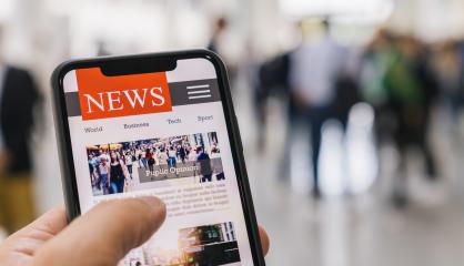 Online news in mobile phone. Close up of smartphone screen. Businessman reading articles in application. Hand holding smart device. Mockup website. Newspaper and portal on internet.- Stock Photo or Stock Video of rcfotostock | RC-Photo-Stock
