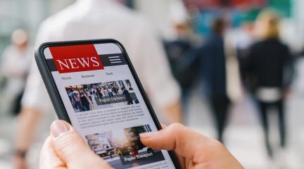 Online news on a mobile phone. Close up of businesswoman reading news or articles in a smartphone screen application. Hand holding smart device. Mockup website. Newspaper and portal on internet.- Stock Photo or Stock Video of rcfotostock | RC Photo Stock