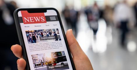Online news on a mobile smartphone. Close up of businesswoman reading news or articles in a smartphone screen application. Hand holding smart device. Mockup website. Newspaper and portal on internet.- Stock Photo or Stock Video of rcfotostock | RC Photo Stock