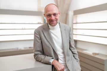 optician with glasses smiling to camera at an eyewear shop. He i- Stock Photo or Stock Video of rcfotostock | RC Photo Stock