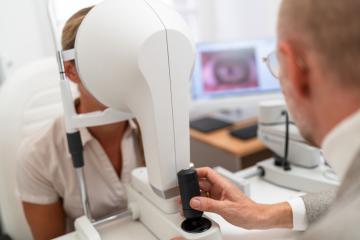 Optometrist administering with Keratograph an eye test to a female patient at the ophthalmology clinic. Close-up photo. Healthcare and medicine concept- Stock Photo or Stock Video of rcfotostock | RC Photo Stock