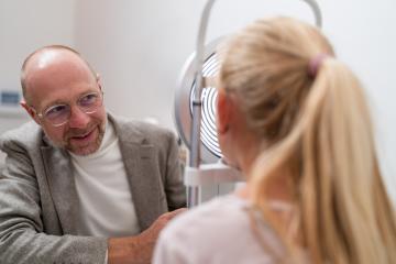 Optometrist during optical analysis with keratograph a child's eye examination at the ophthalmology clinic. Close-up photo. Healthcare and medicine concept- Stock Photo or Stock Video of rcfotostock | RC Photo Stock