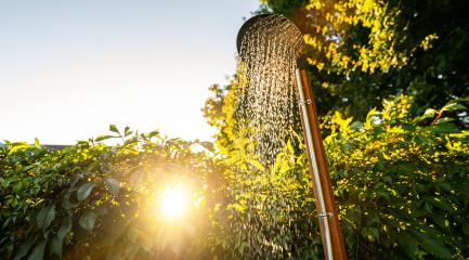 Outdoor shower at sunrise for showering body before jumping in the resort pool. Golden Hour Refreshment Spa wellness concept image- Stock Photo or Stock Video of rcfotostock | RC Photo Stock