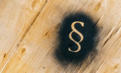 Paragraph sign sprayed on a wood plate - Symbol of Law and Justice- Stock Photo or Stock Video of rcfotostock | RC Photo Stock