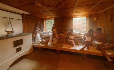 people relaxing together relax in hot finnish sauna. dramtic light with Steam, spa and wellness concept.- Stock Photo or Stock Video of rcfotostock | RC Photo Stock