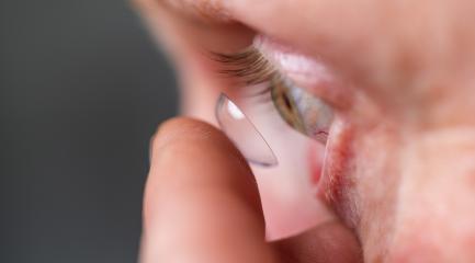 Person inserting a contact lens into their eye. Close-up view of- Stock Photo or Stock Video of rcfotostock | RC Photo Stock