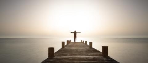 Person stands with open arms on wooden path at sunrise. Powerful mediations, relaxation, recharge your batteries and enjoy life.- Stock Photo or Stock Video of rcfotostock | RC Photo Stock