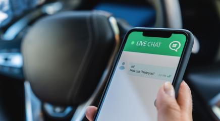 Person use customer service and support live chat with chatbot and automatic messages or human servant in the car. Assistance and help with mobile phone app. Smartphone helpdesk for feedback cell.- Stock Photo or Stock Video of rcfotostock | RC-Photo-Stock