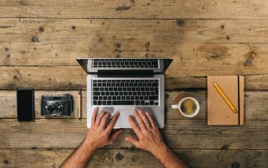 Photographer working at office desk with laptop, silver notebook, mobile phone, pen, camera and coffee cup, flat lay. Top view with copyspace for your individual text.- Stock Photo or Stock Video of rcfotostock | RC Photo Stock